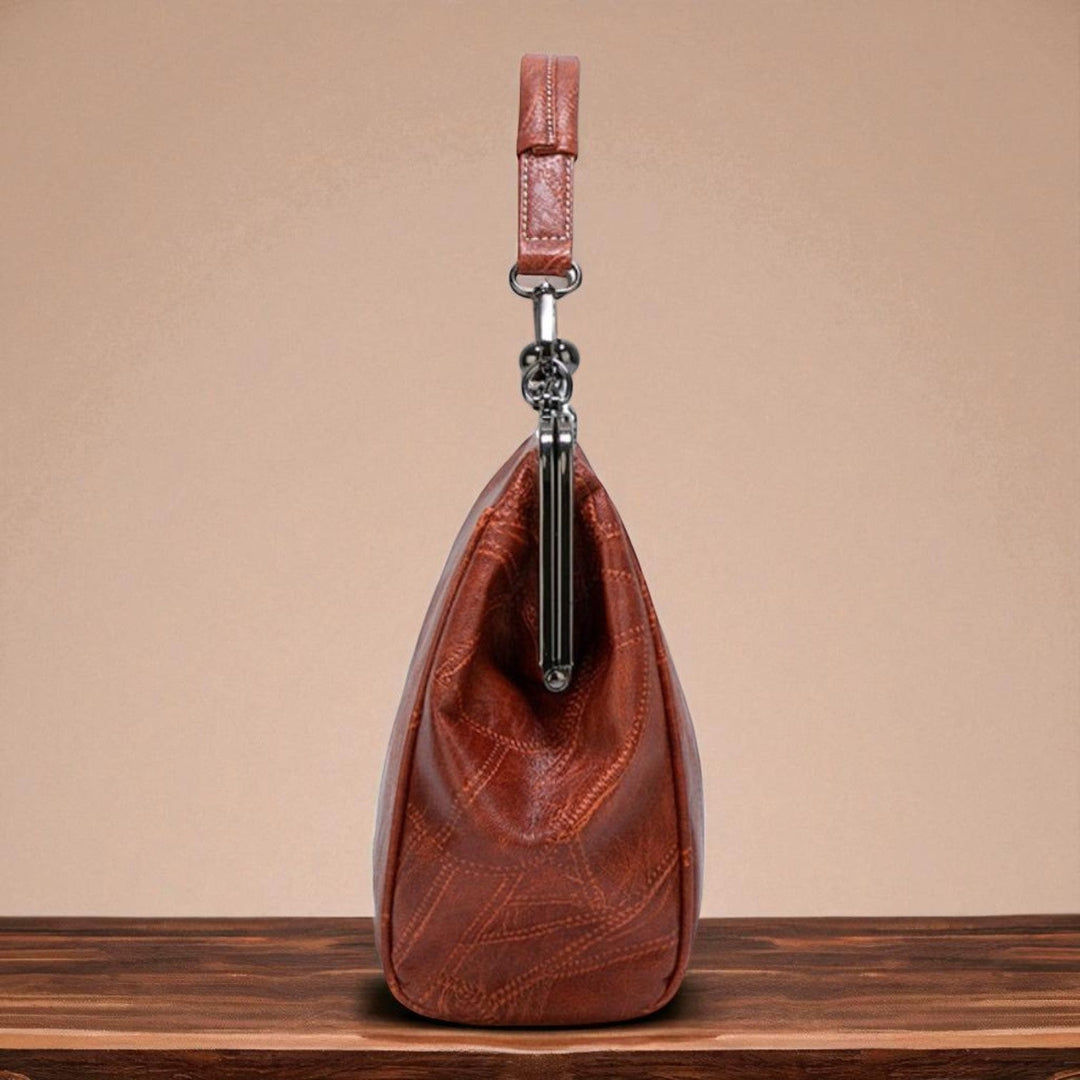 Vintage handbag with clasp closure