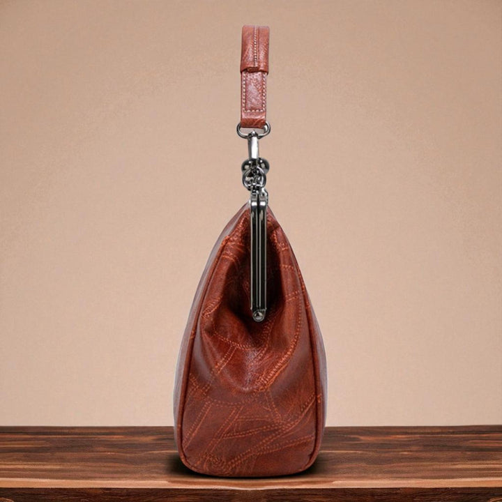 Vintage handbag with clasp closure