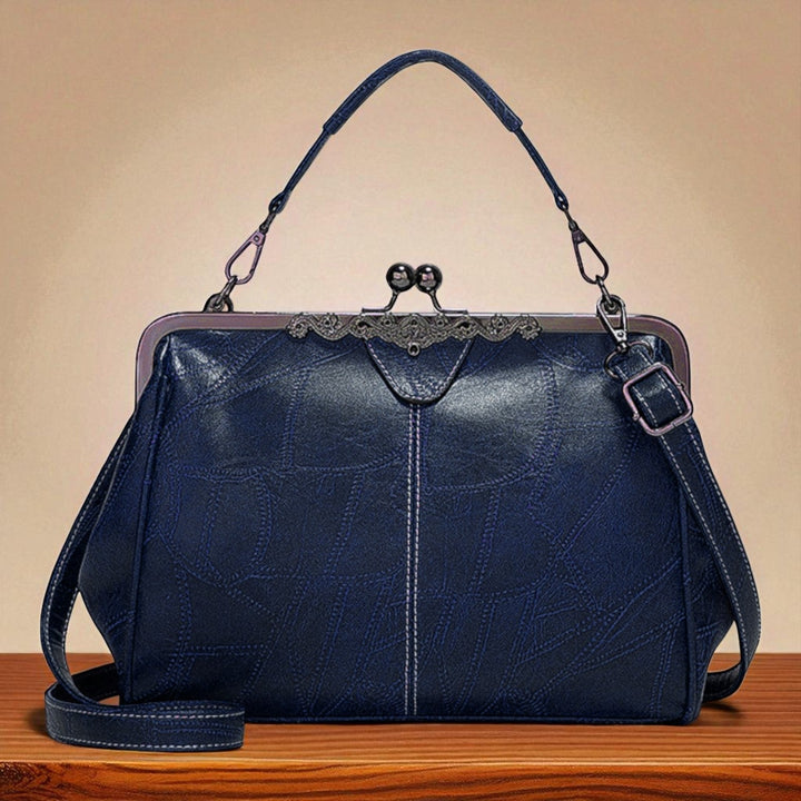 Vintage handbag with clasp closure