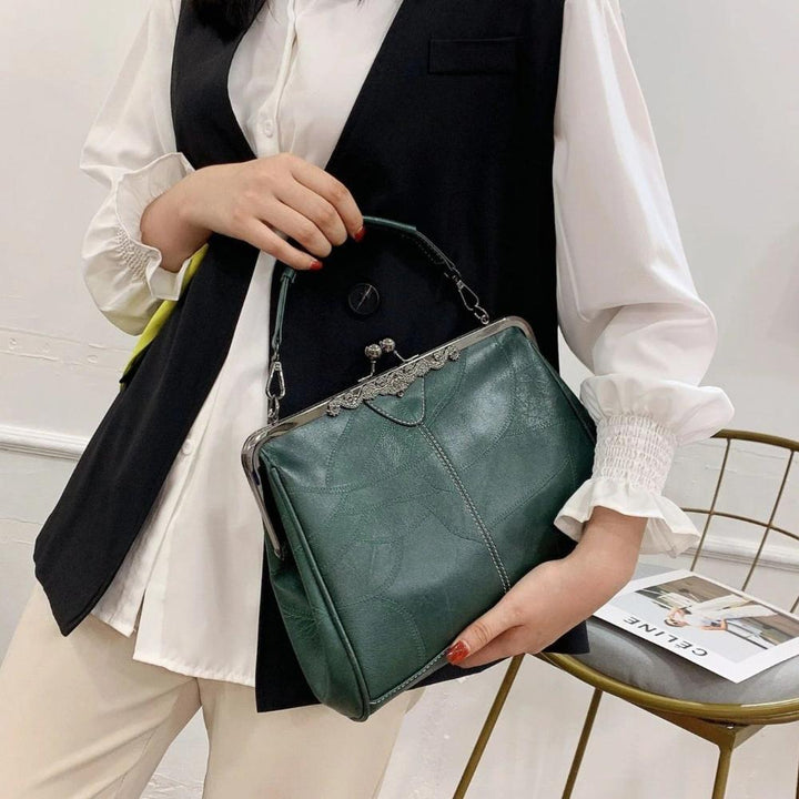 Vintage handbag with clasp closure